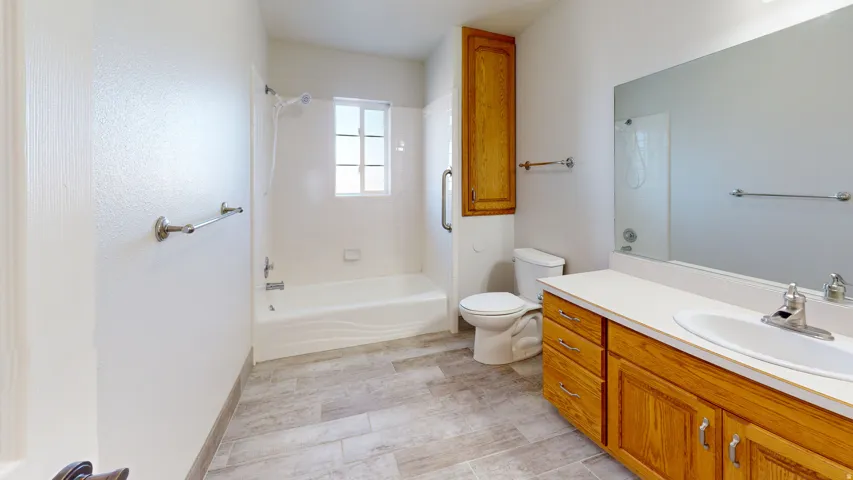Bathroom with vanity and shower / tub combination