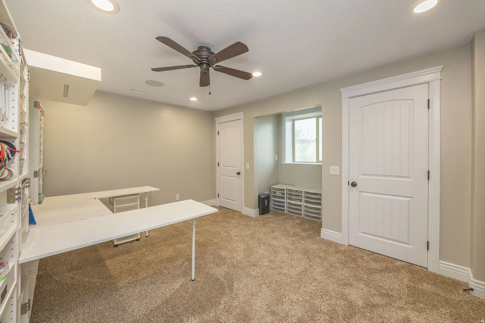 Unfurnished office with light colored carpet, recessed lighting, and ceiling fan