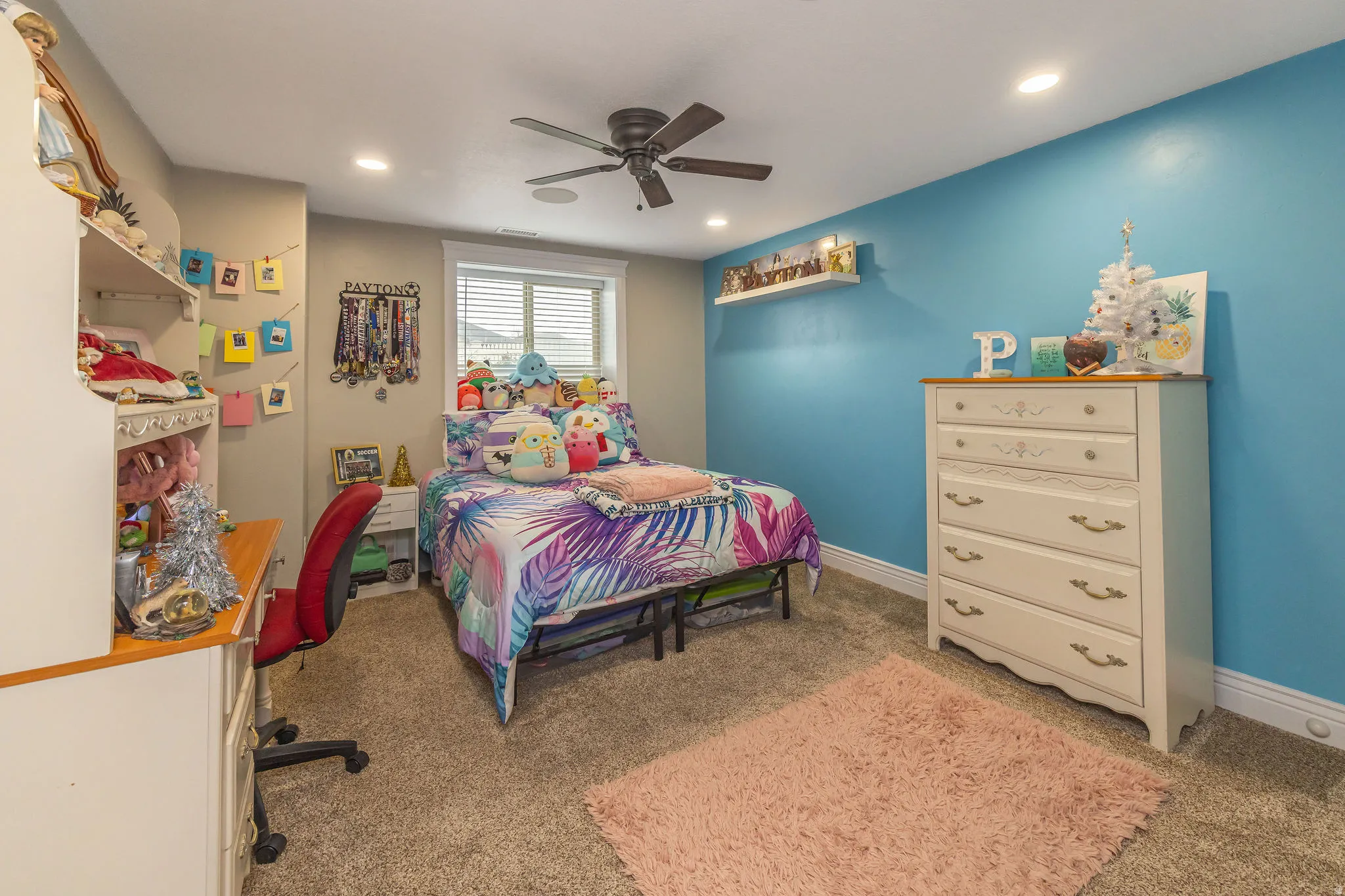 Bedroom featuring light carpet and ceiling fan