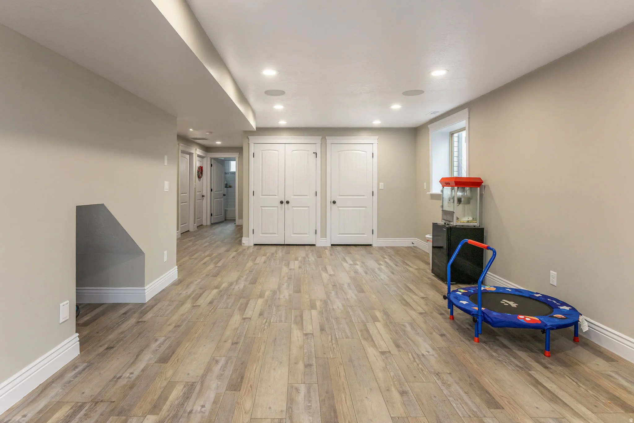 Game room featuring light wood-style flooring and recessed lighting