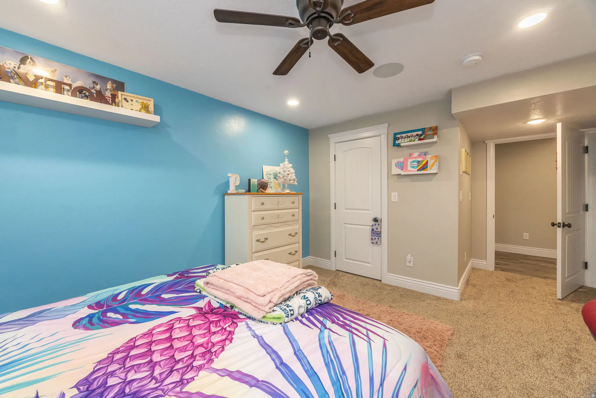 Bedroom featuring light carpet, a ceiling fan, recessed lighting, and a closet