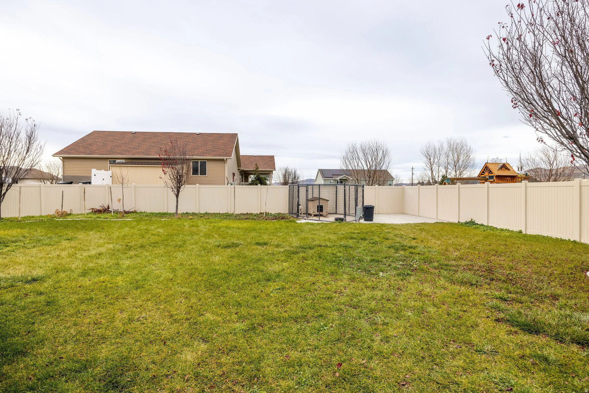 Fenced backyard featuring a patio area
