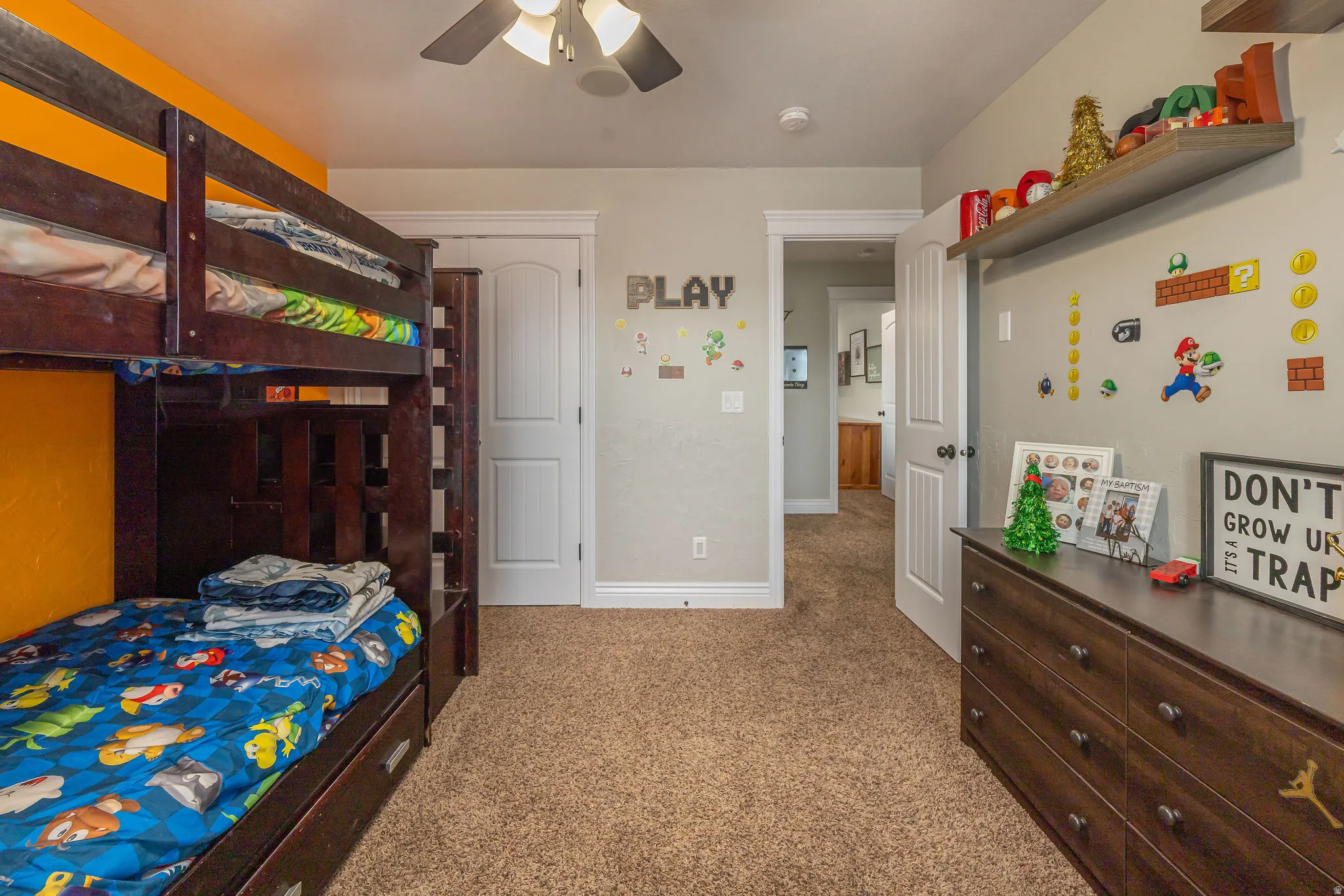 Bedroom featuring light colored carpet and a ceiling fan