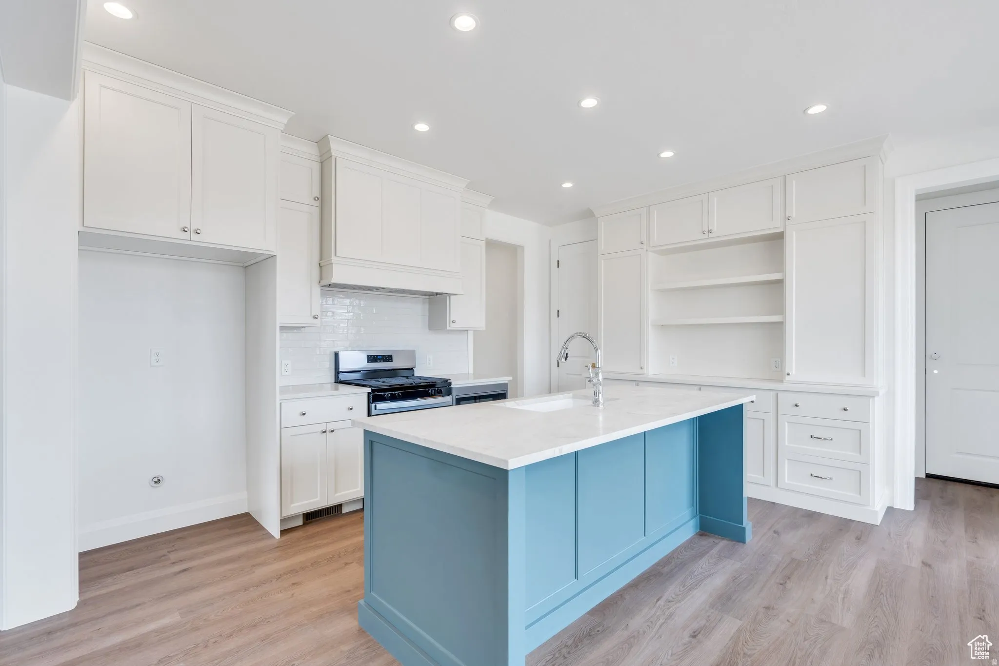 Classic white kitchen with lovely blue island