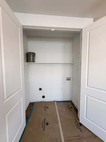 Laundry area with hookup for a washing machine and hookup for an electric dryer
