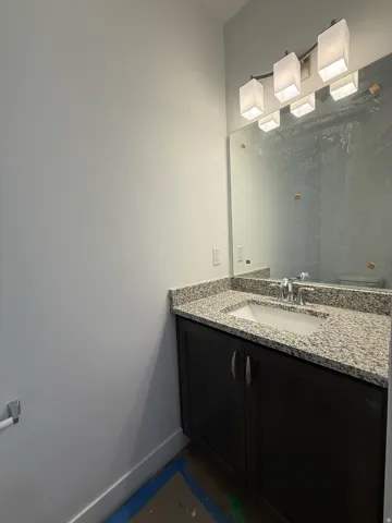 Bathroom with baseboards and vanity