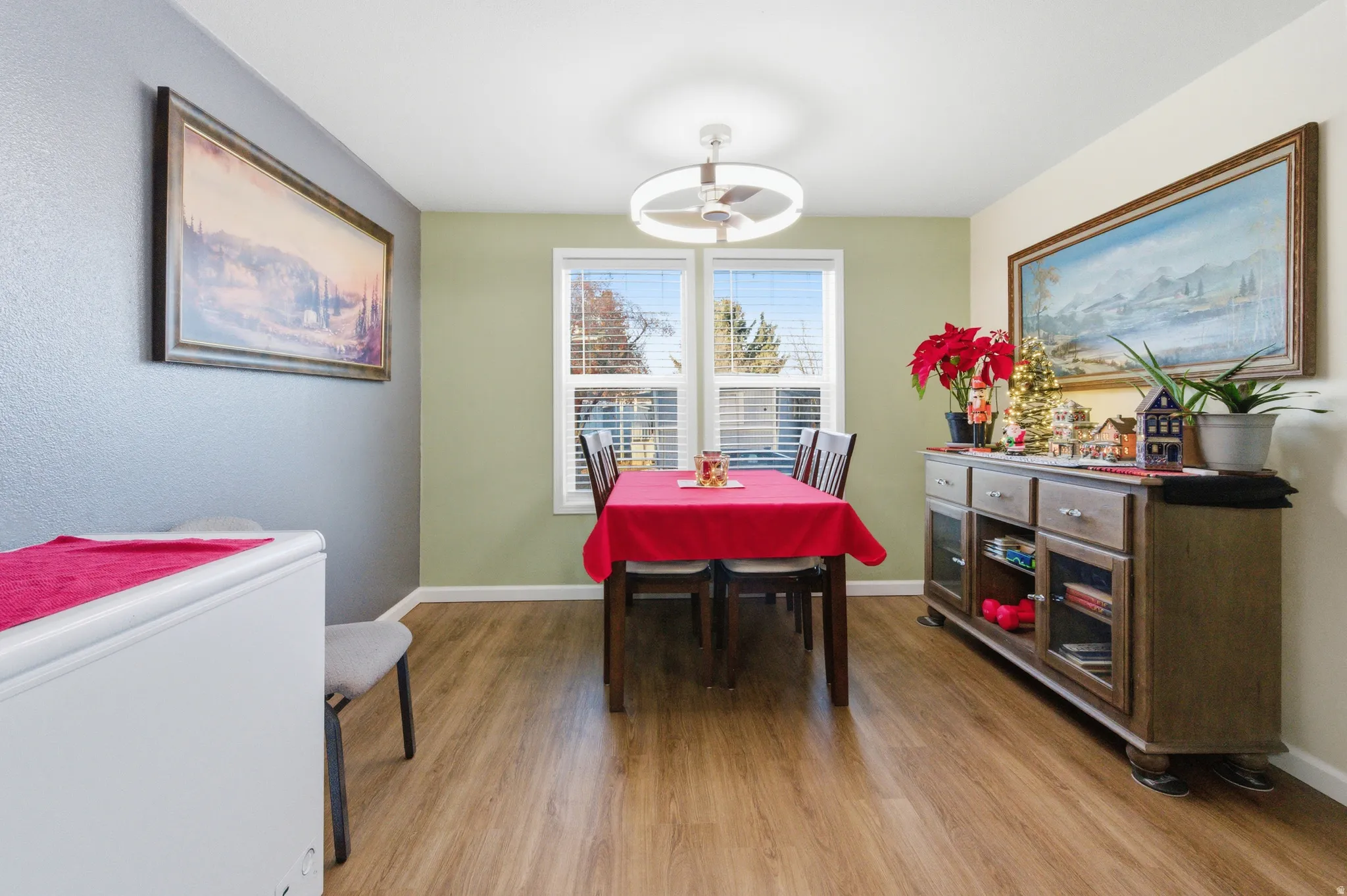 Dining area featuring baseboards and light wood finished floors