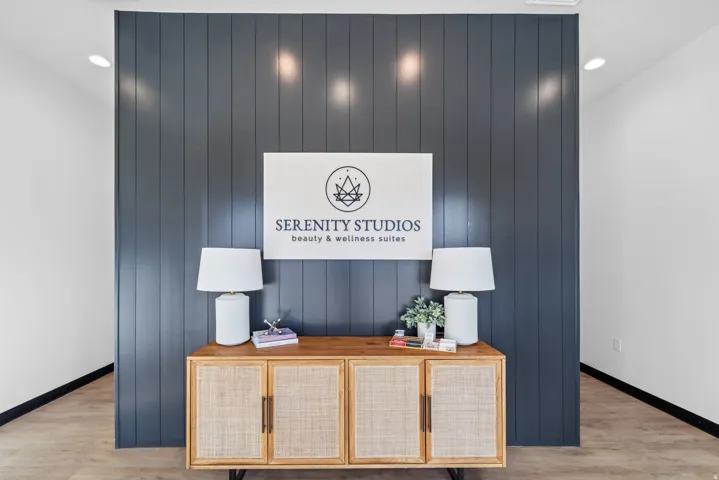 Detailed view of wooden walls, recessed lighting, wood finished floors, and an accent wall