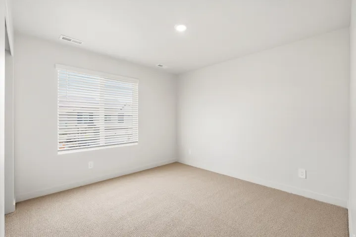 **DISLCAIMER** Exterior & Interior packages may vary.Carpeted empty room with baseboards and recessed lighting