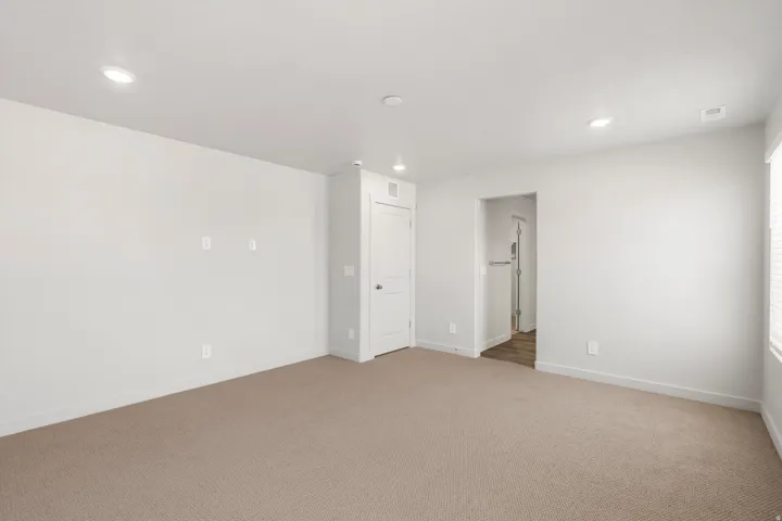 **DISLCAIMER** Exterior & Interior packages may vary.Unfurnished room featuring light carpet and recessed lighting