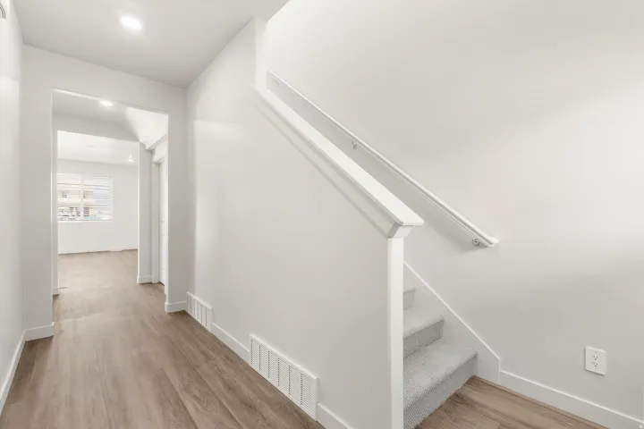**DISLCAIMER** Exterior & Interior packages may vary.Stairway featuring wood finished floors and recessed lighting