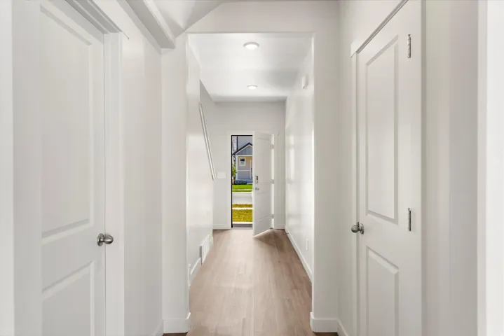 **DISLCAIMER** Exterior & Interior packages may vary.Hallway featuring baseboards and light wood-style flooring