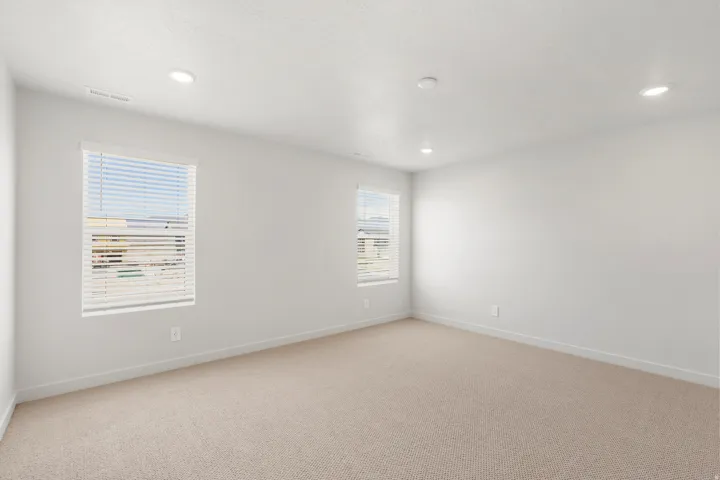 **DISLCAIMER** Exterior & Interior packages may vary.Empty room featuring light colored carpet and recessed lighting