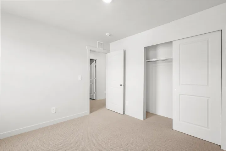 **DISLCAIMER** Exterior & Interior packages may vary.Unfurnished bedroom with carpet flooring and a closet