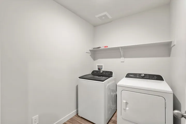 **DISLCAIMER** Exterior & Interior packages may vary.Washroom with light wood-style floors and washer and dryer