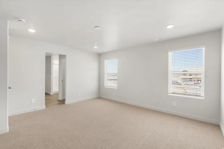 **DISLCAIMER** Exterior & Interior packages may vary.Unfurnished room featuring light carpet and recessed lighting