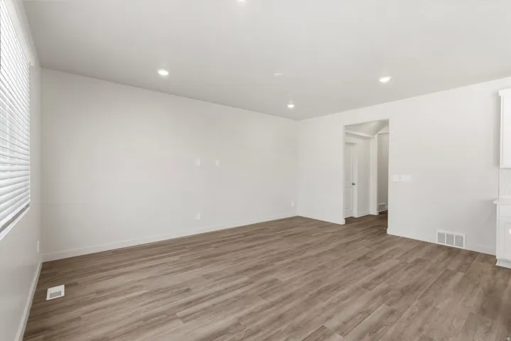 **DISLCAIMER** Exterior & Interior packages may vary.Unfurnished room featuring light wood finished floors and recessed lighting