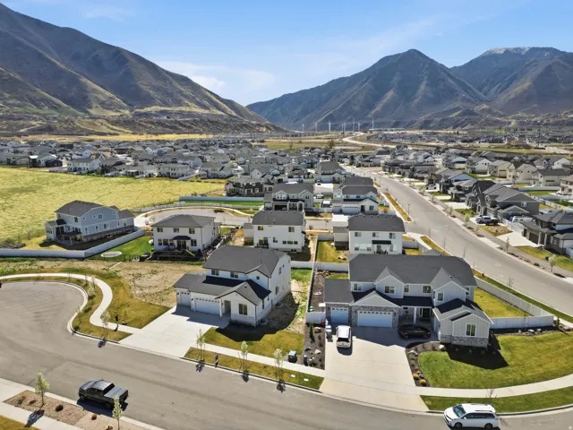 Aerial perspective of suburban area featuring a mountainous background