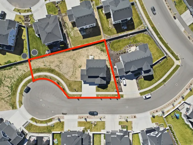 Red Boundary lines--Aerial view of residential area featuring property parcel outlined