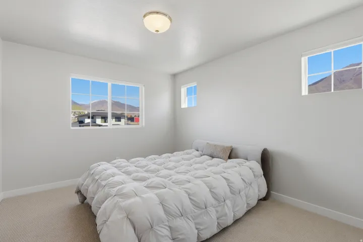 3rd Bedroom with baseboards and carpet floors