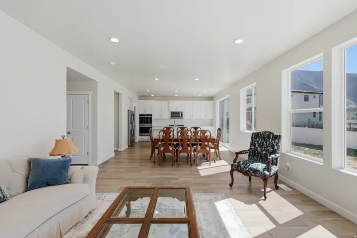Living room featuring light wood-type flooring and recessed lighting