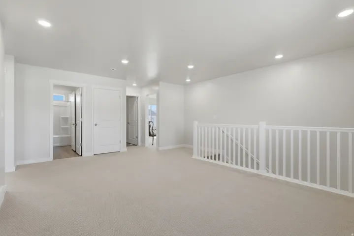 Loft Family Room featuring light colored carpet and recessed lighting