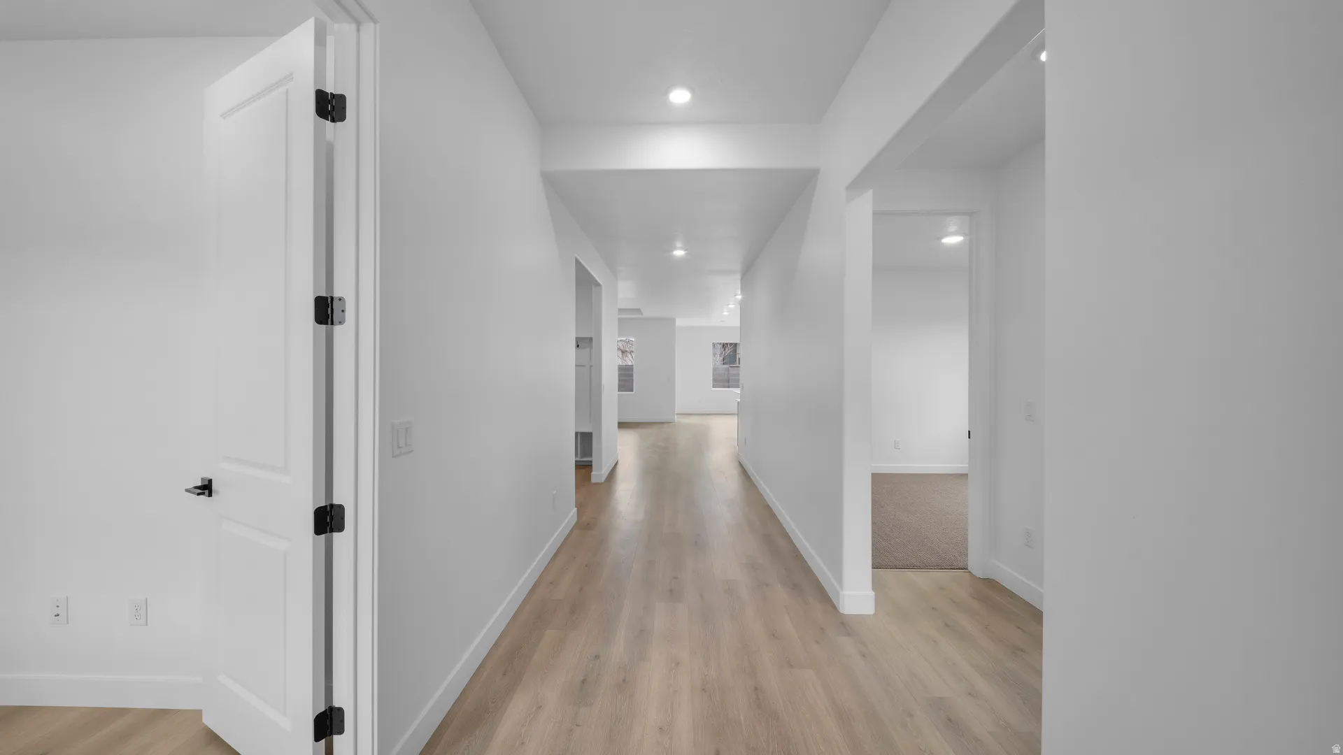 Hall featuring recessed lighting and light wood-style floors