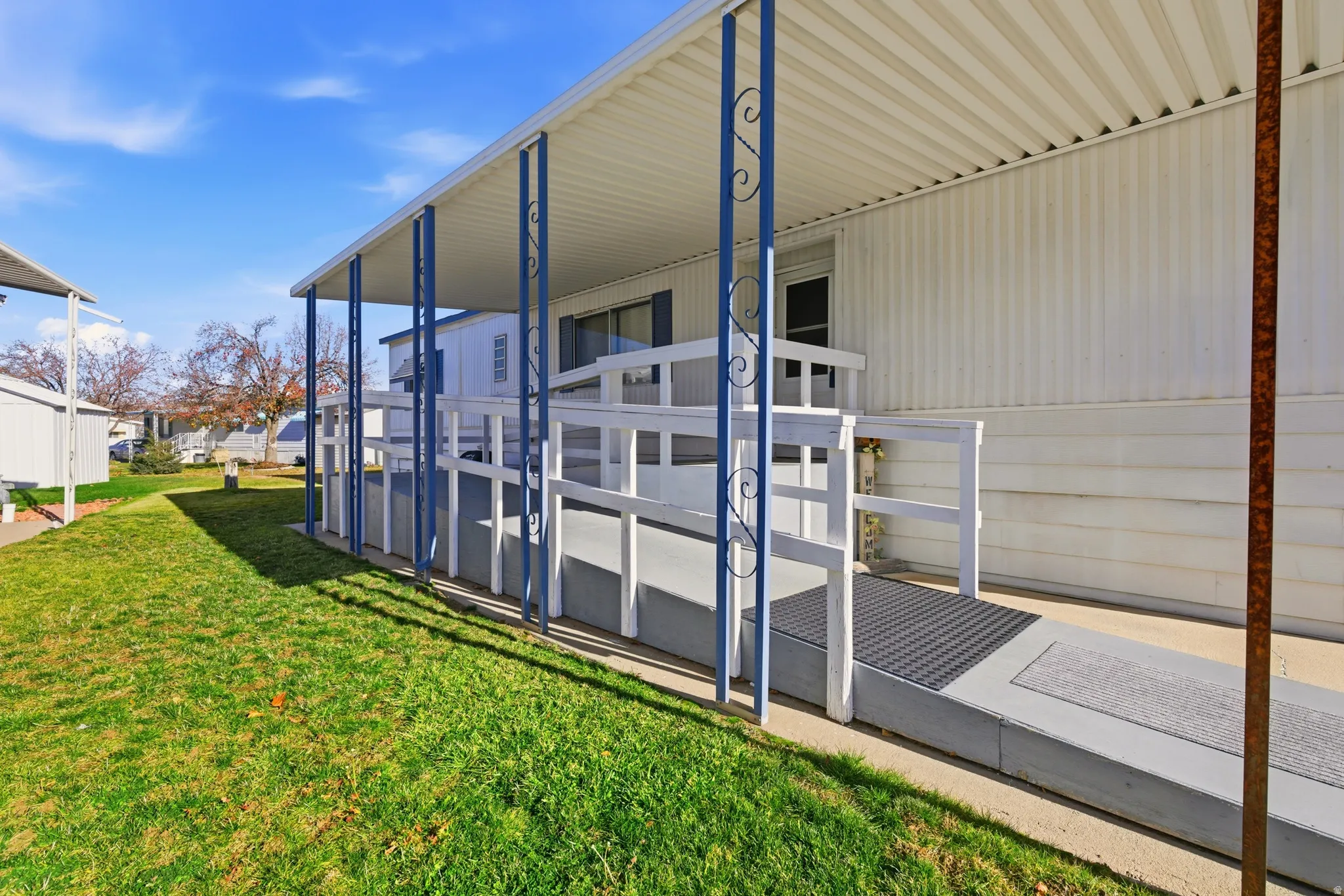 View of side of home featuring a lawn