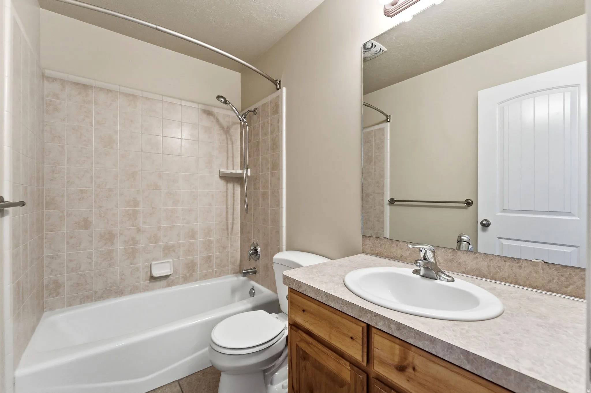 Full bath with bathing tub / shower combination and vanity