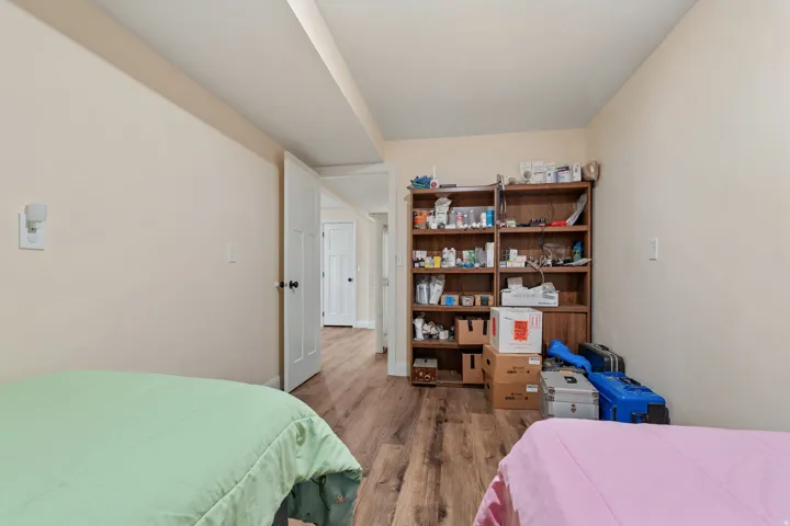 Storage room/bonus space with wood finished floors