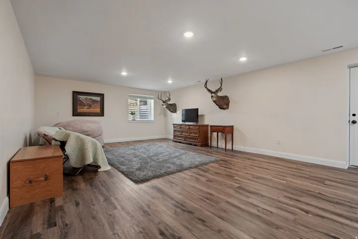 Sitting room with recessed lighting and wood finished floors
