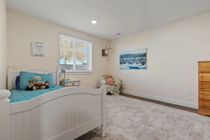 Bedroom featuring wood finished floors and recessed lighting