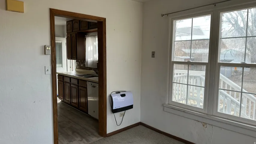 Doorway with heating unit and a sink