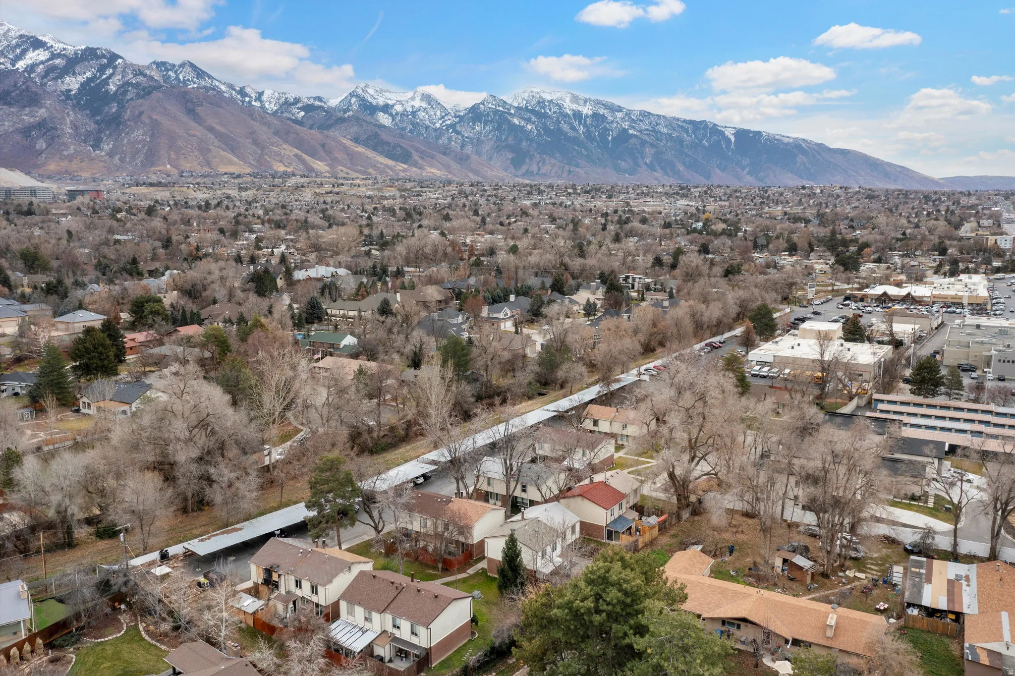 View of property location with a mountainous background and nearby suburban area