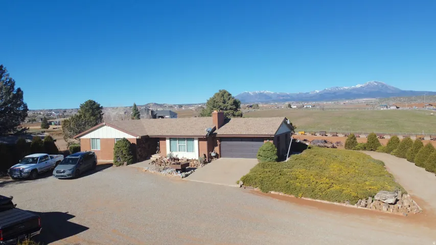 Single story home featuring a mountain view, and an attached garage