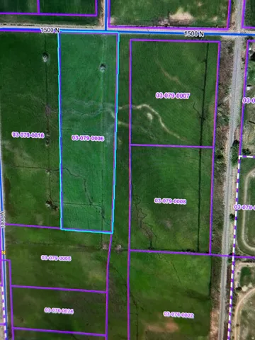 Aerial map of property and surrounding area featuring property boundaries highlighted