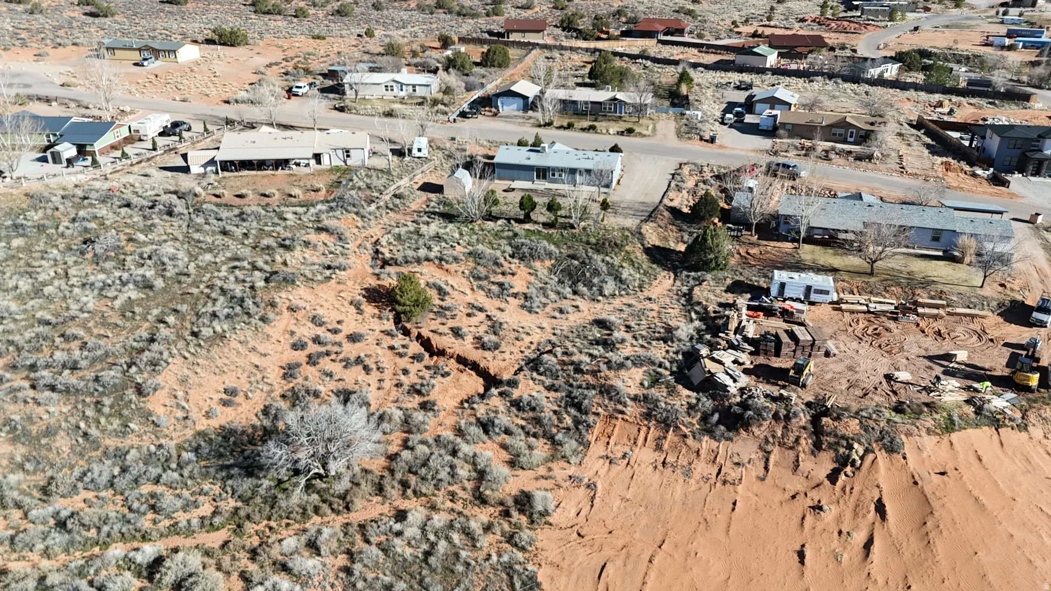 Aerial view of property's location with a desert landscape and nearby suburban area