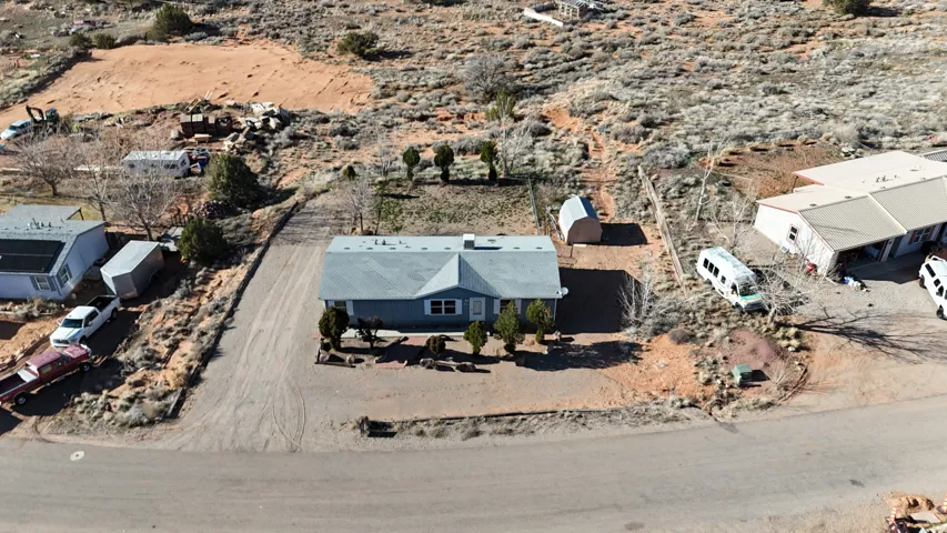 View of subject property with a desert landscape