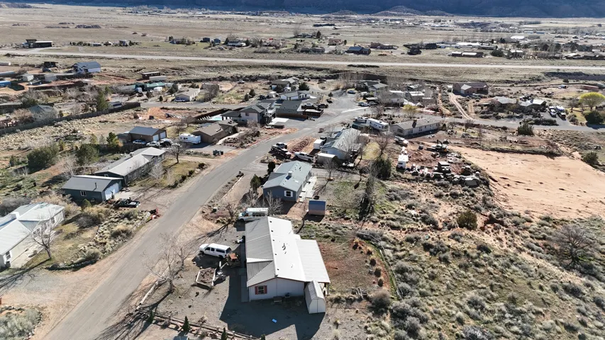 View of property location with nearby suburban area and a desert landscape