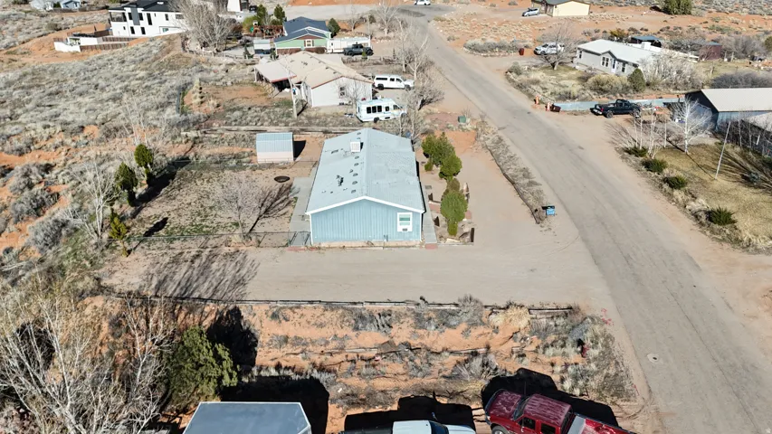 Aerial overview of property's location with nearby suburban area