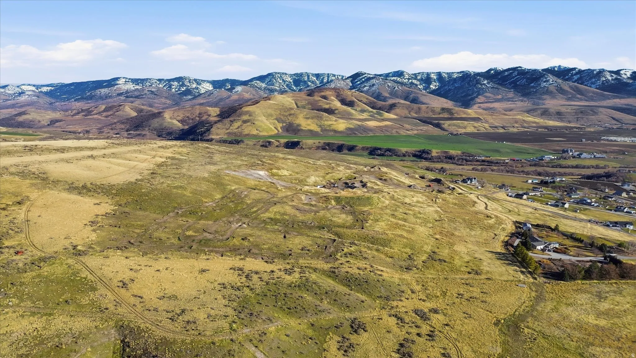 View of mountain backdrop featuring rural landscape