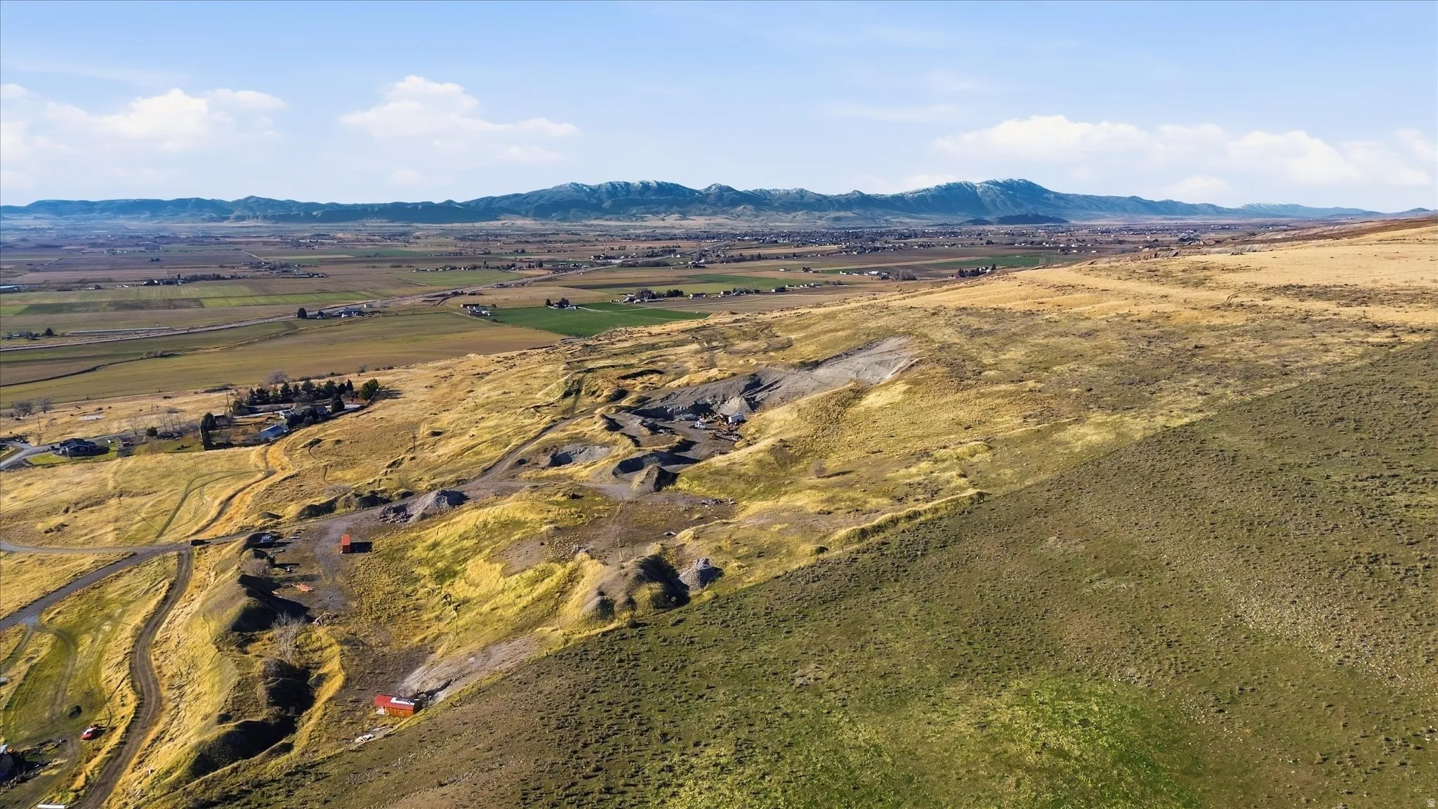 View of mountain backdrop featuring rural landscape