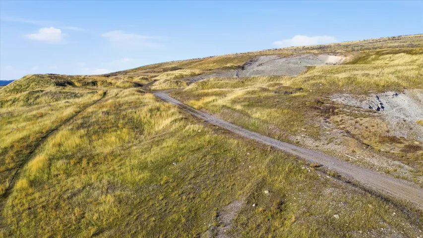 Aerial view of property and surrounding area featuring rural landscape