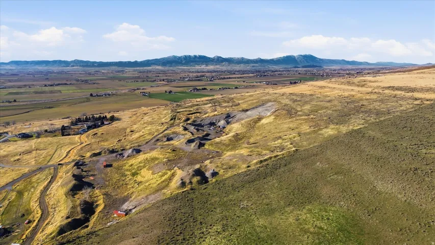 View of mountain backdrop featuring rural landscape