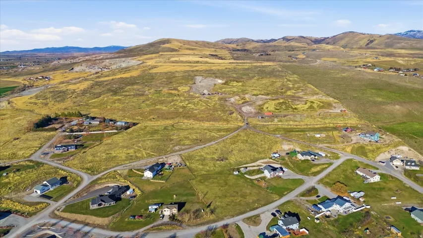 View of property location featuring a mountain backdrop and rural landscape
