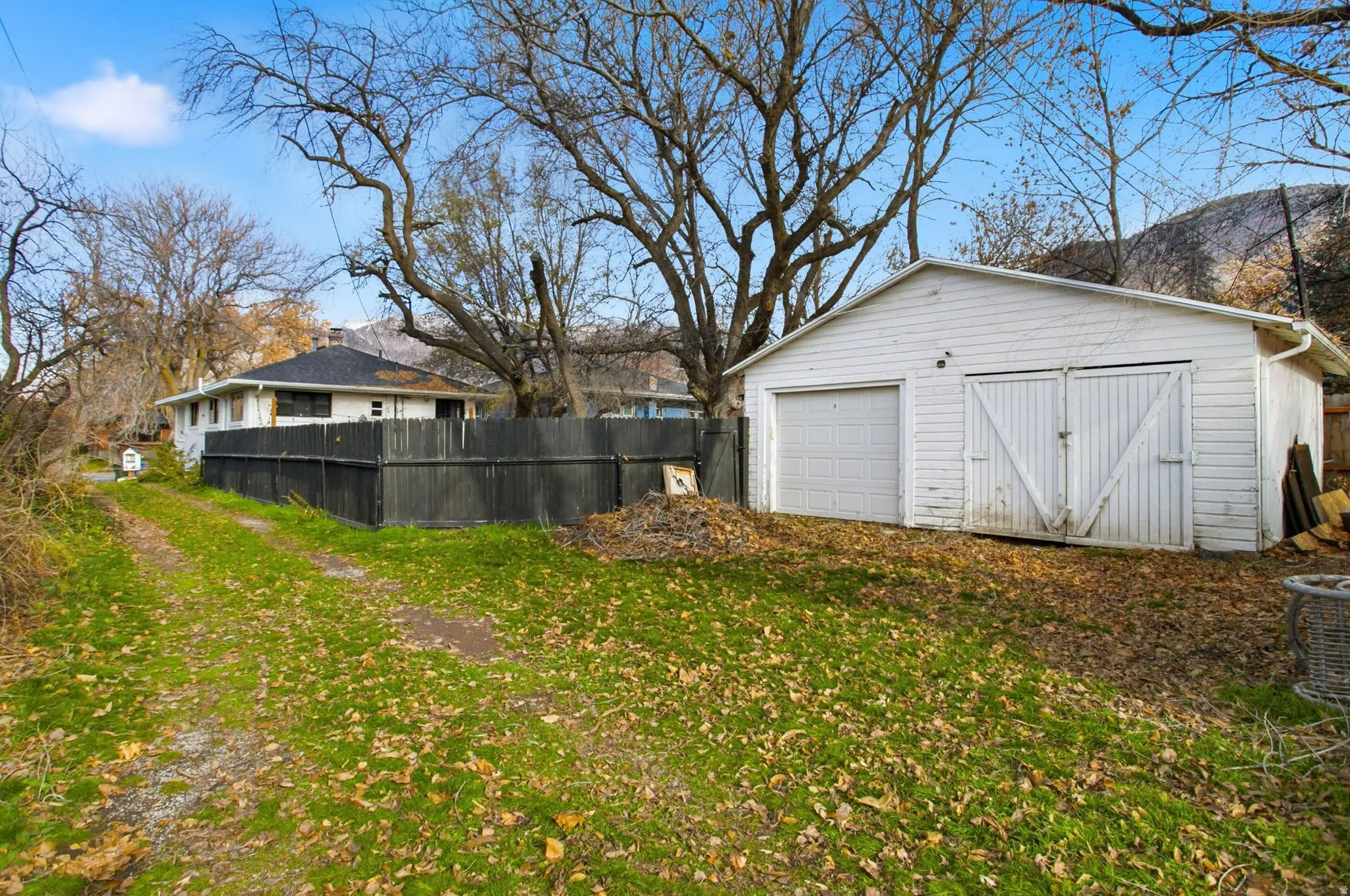 View of yard featuring an outbuilding and a detached garage