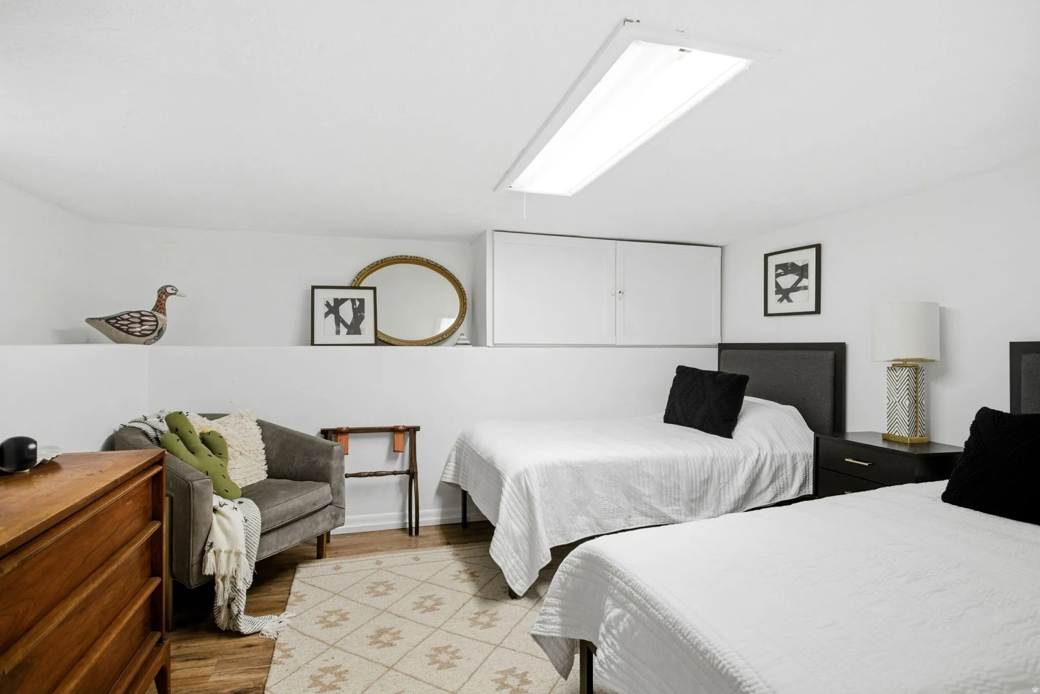 Bedroom with light wood-style floors