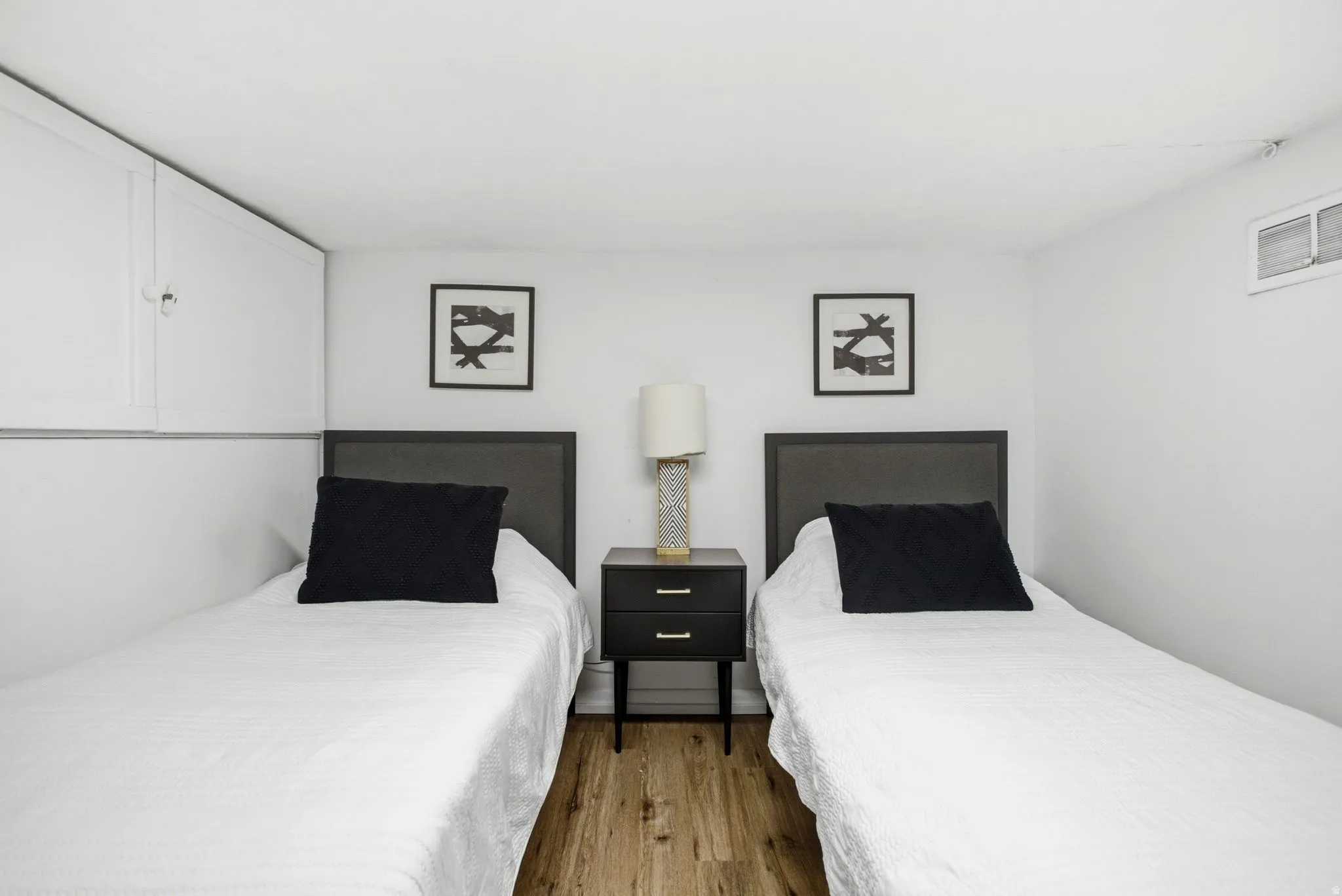 Bedroom with wood finished floors