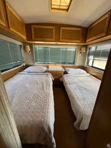 Carpeted bedroom featuring a textured ceiling