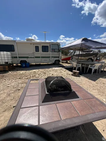 View of yard with a fire pit